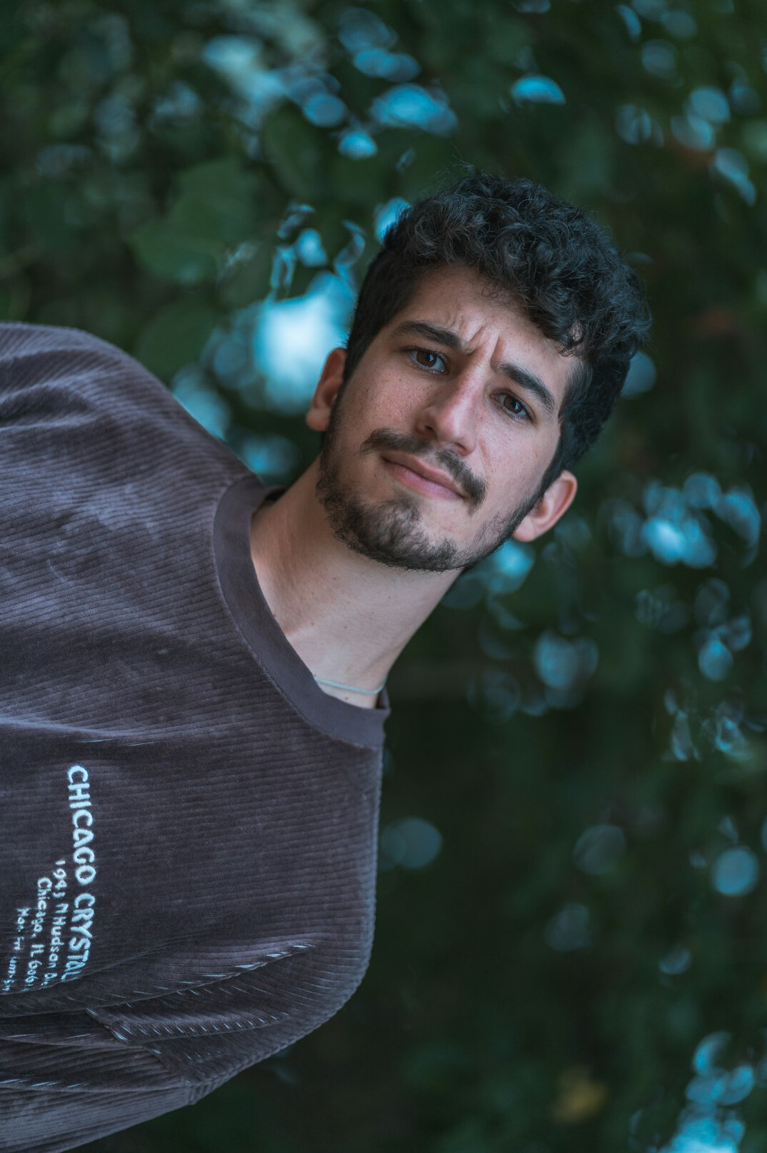 Portrait of a man with short dark hair and a light beard